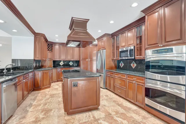 a bathroom with a window a sink and a shower