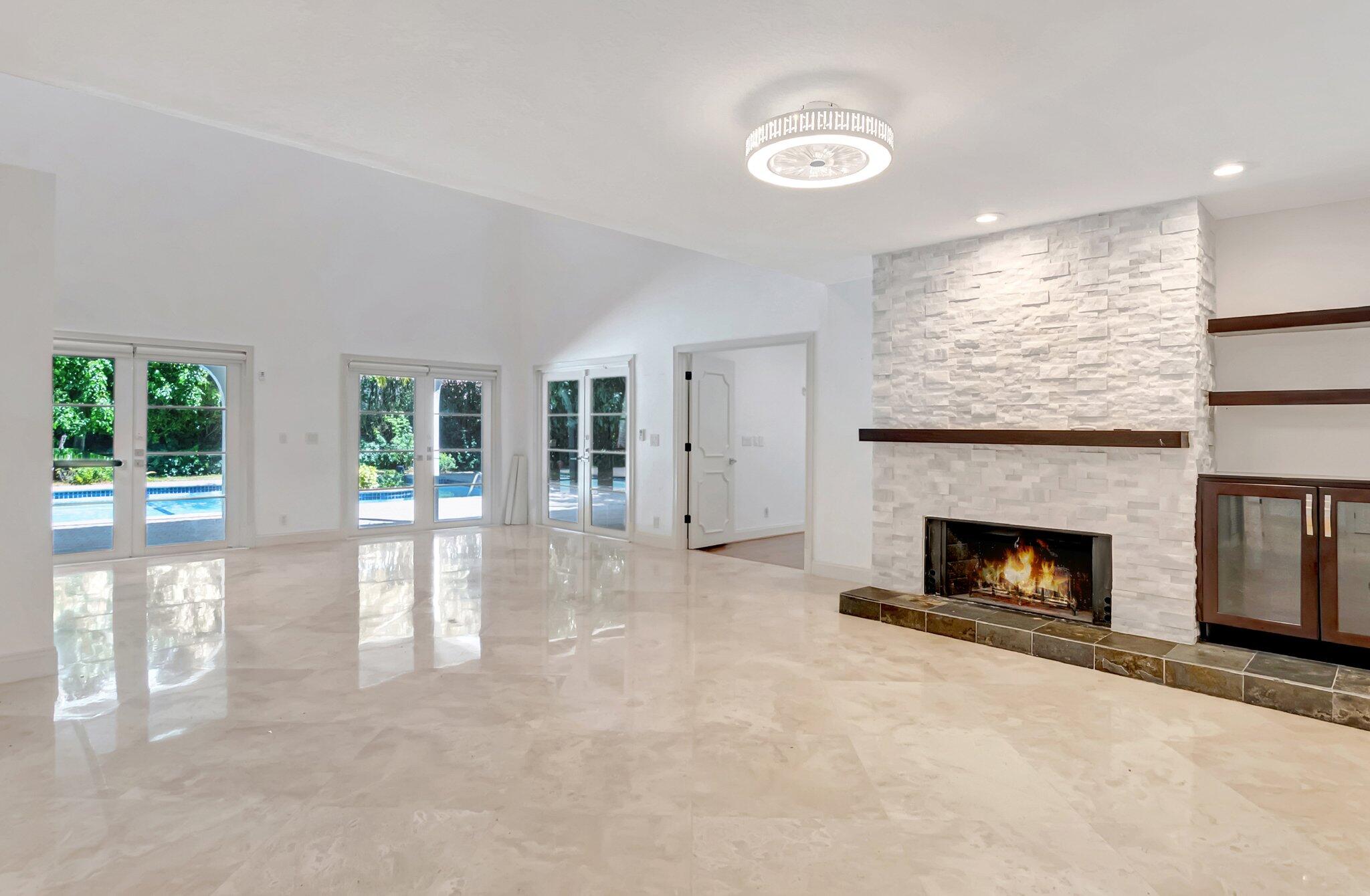 930 Parkside Circle North Boca Raton, FL 33486 - Photo 24 of 81 a view of empty room with fireplace and fan