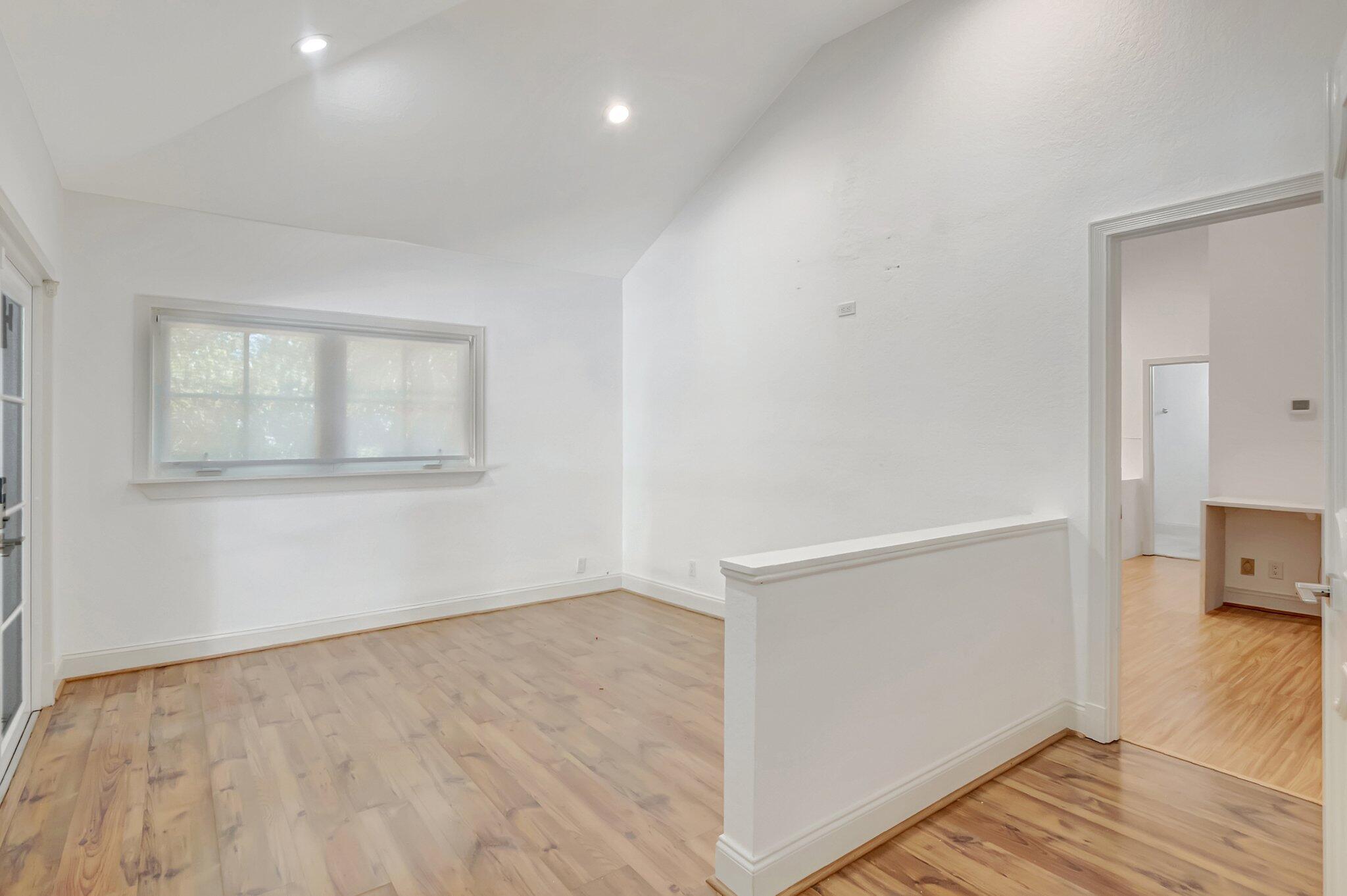930 Parkside Circle North Boca Raton, FL 33486 - Photo 30 of 81 an empty room with wooden floor and windows