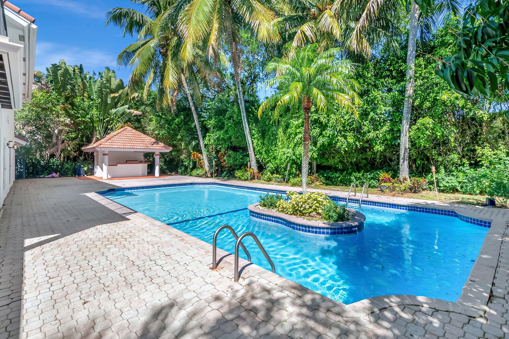 930 Parkside Circle North Boca Raton, FL 33486 - Photo 3 of 81 a view of a swimming pool with a patio