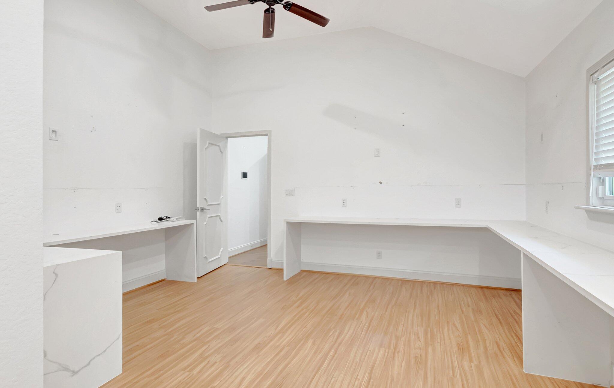 930 Parkside Circle North Boca Raton, FL 33486 - Photo 33 of 81 a view of an empty room with wooden floor and a window