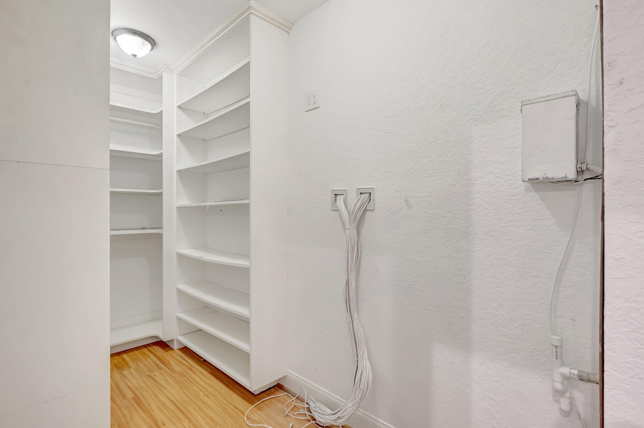 930 Parkside Circle North Boca Raton, FL 33486 - Photo 36 of 81 a view of walk in closet with empty racks