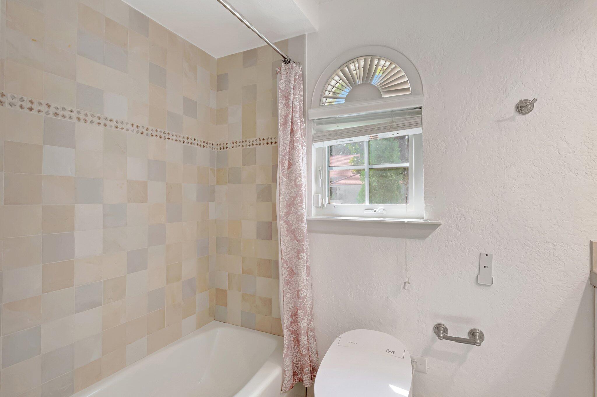 930 Parkside Circle North Boca Raton, FL 33486 - Photo 44 of 81 a bathroom with a toilet a sink and a window