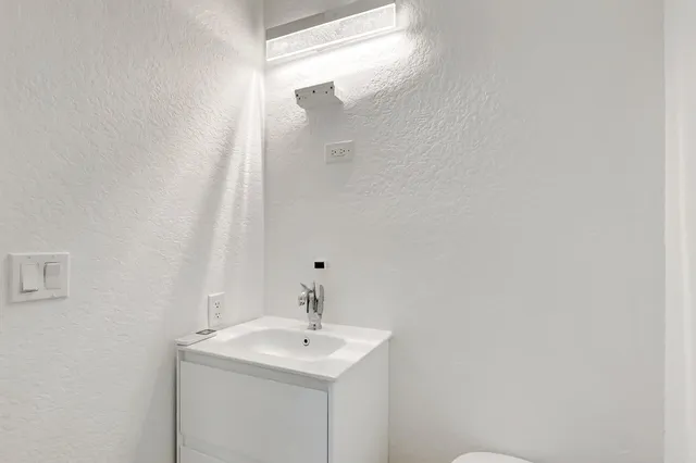 a view of a swimming pool with a yard