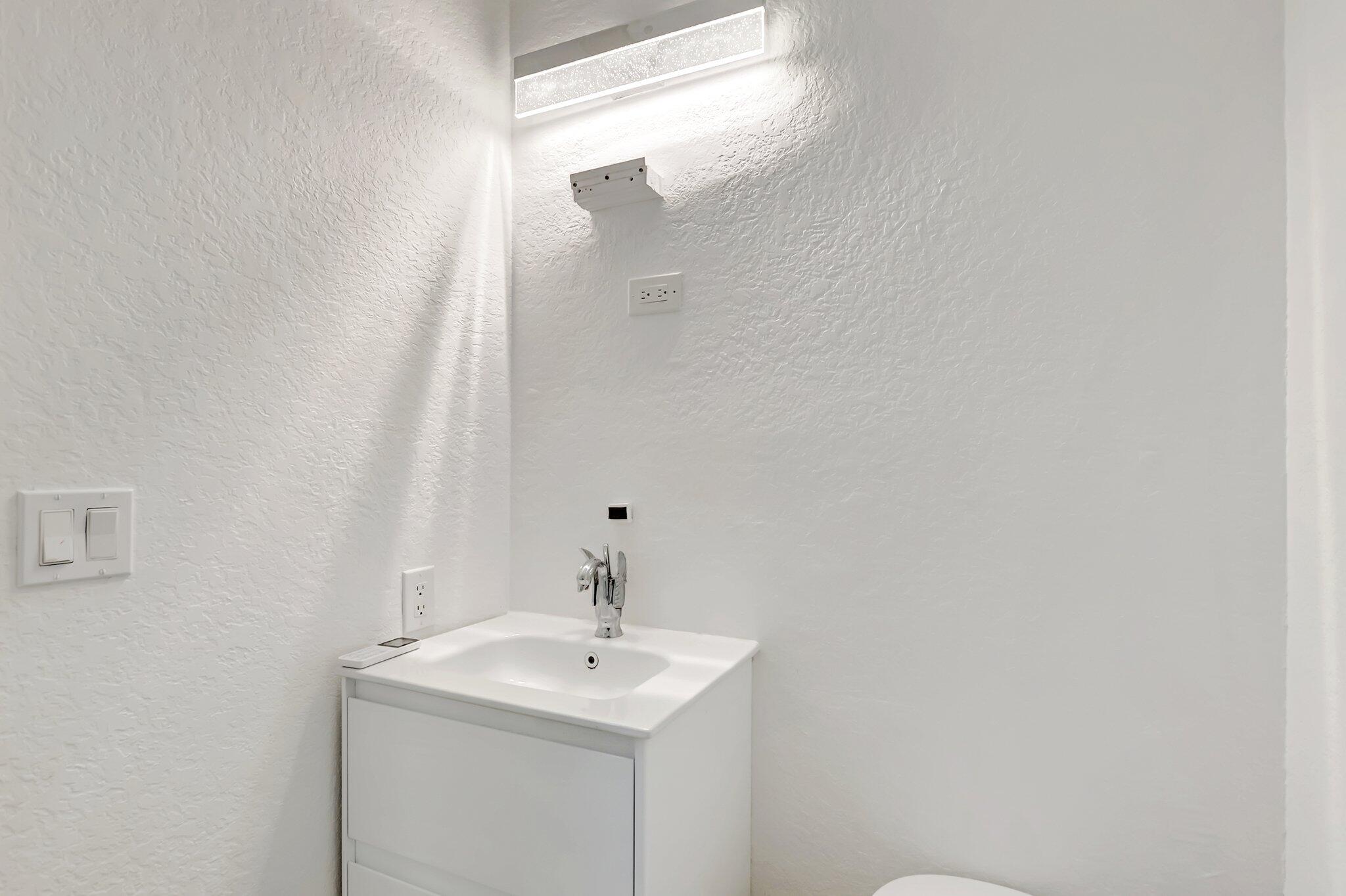 930 Parkside Circle North Boca Raton, FL 33486 - Photo 46 of 81 a bathroom with a sink and a mirror