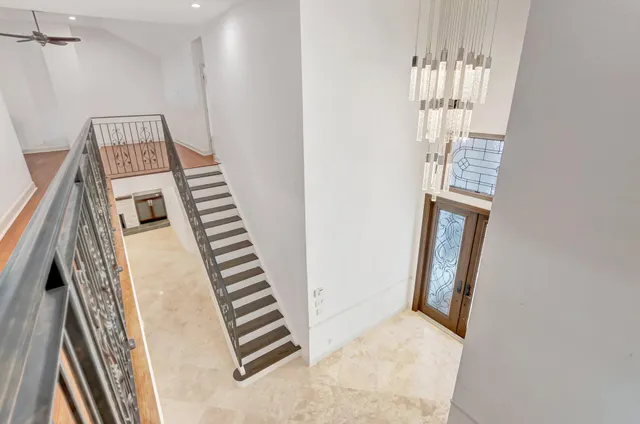 an aerial view of residential house with outdoor space and swimming pool