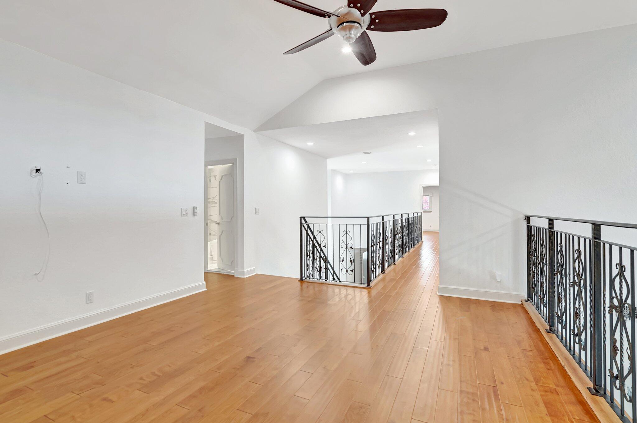 930 Parkside Circle North Boca Raton, FL 33486 - Photo 52 of 81 a view of a hallway with wooden floor and stairs
