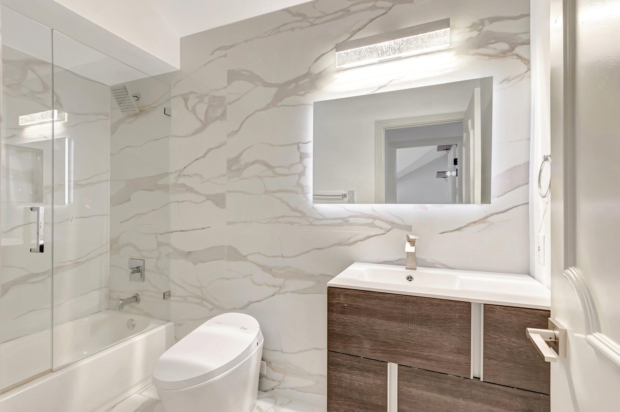 930 Parkside Circle North Boca Raton, FL 33486 - Photo 55 of 81 a bathroom with a sink toilet and shower