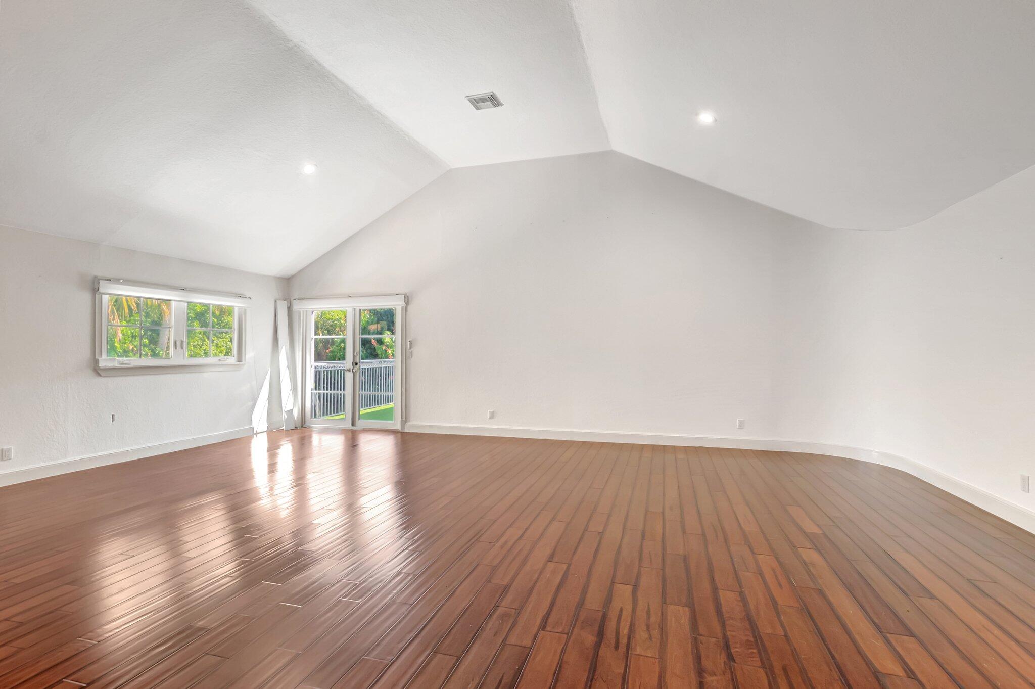 930 Parkside Circle North Boca Raton, FL 33486 - Photo 60 of 81 a view of an empty room with wooden floor and a window