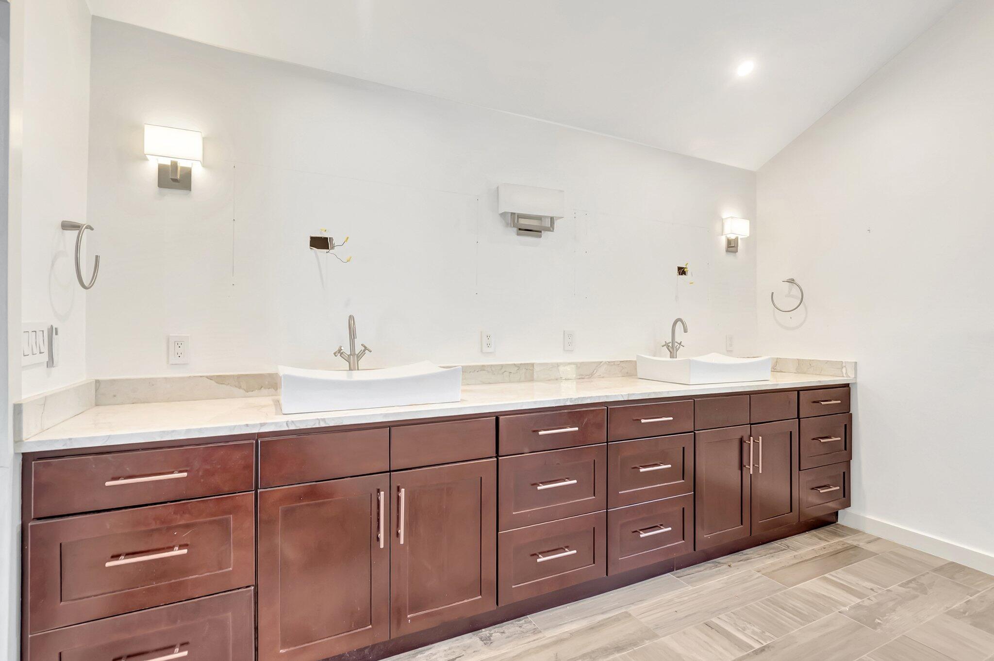 930 Parkside Circle North Boca Raton, FL 33486 - Photo 67 of 81 a bathroom with double vanity sink two mirror and window