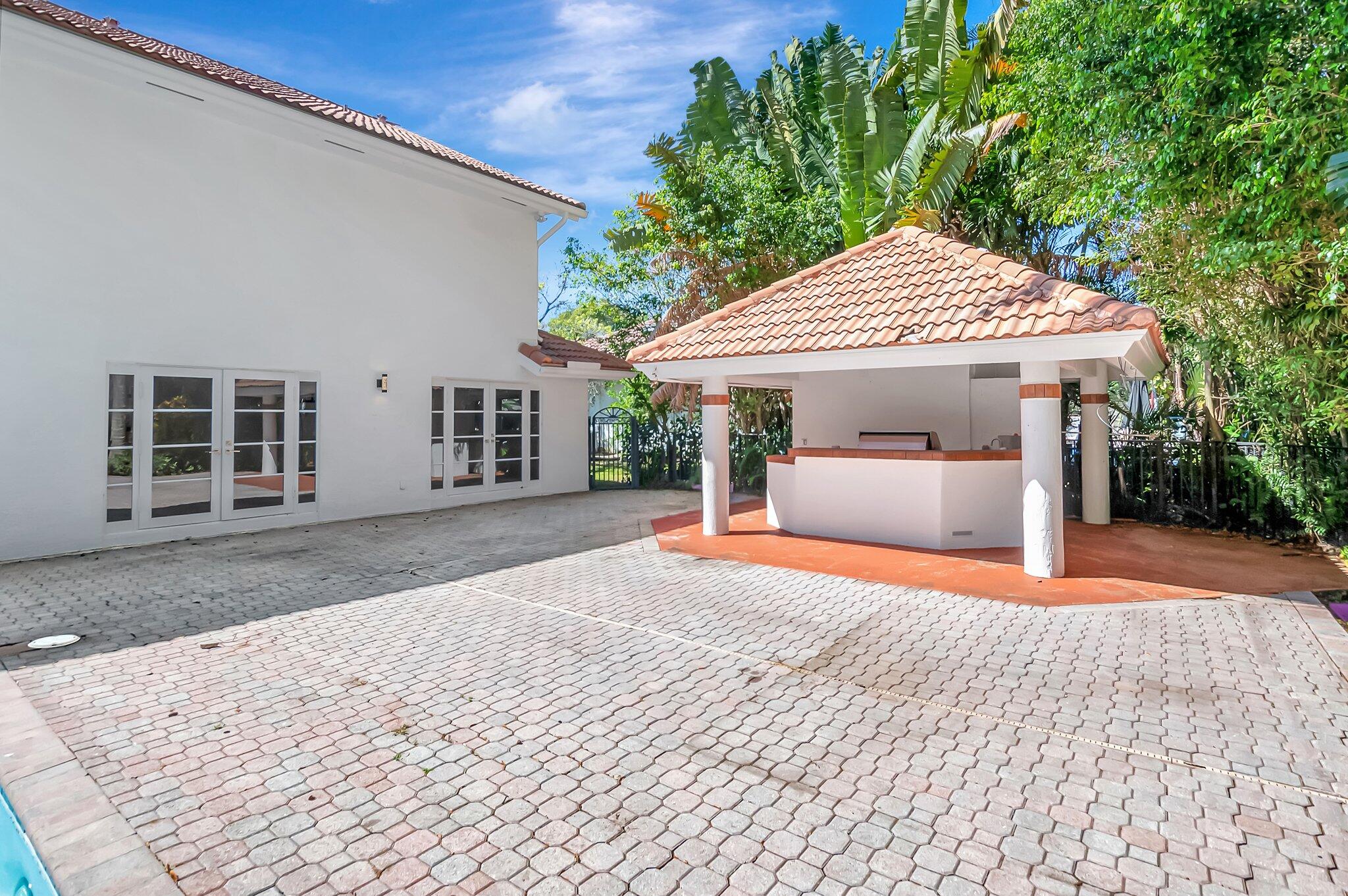 930 Parkside Circle North Boca Raton, FL 33486 - Photo 76 of 81 a front view of a house with a yard and garage
