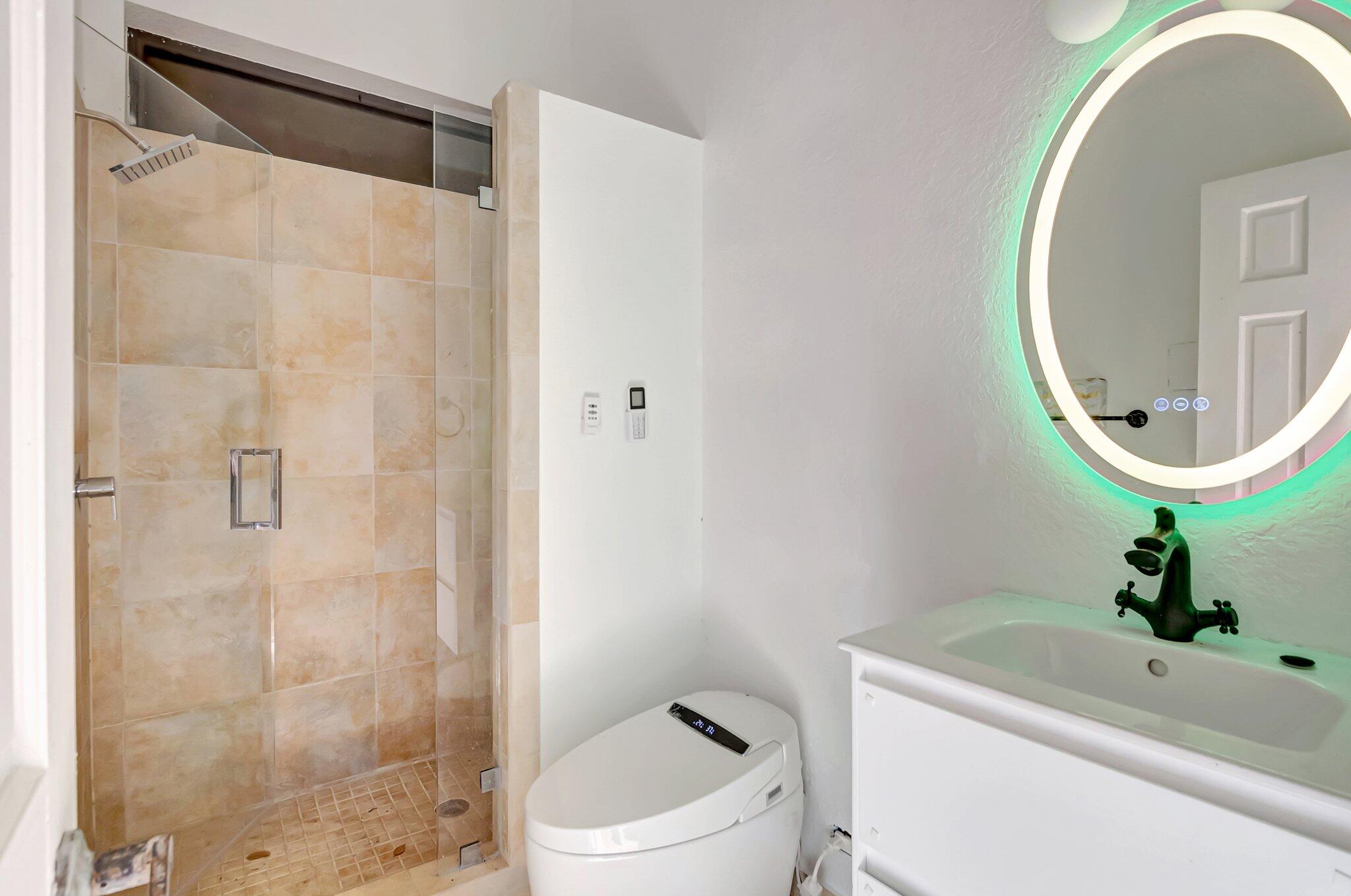 930 Parkside Circle North Boca Raton, FL 33486 - Photo 78 of 81 a bathroom with a sink toilet and shower