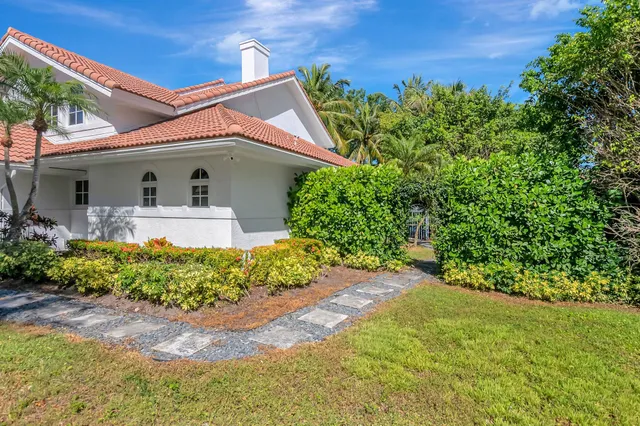 a kitchen with stainless steel appliances granite countertop a refrigerator a stove a sink and a microwave