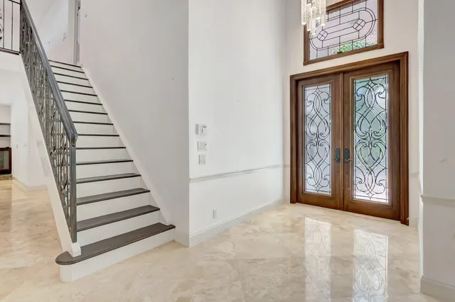 a kitchen with stainless steel appliances granite countertop a stove sink and cabinets