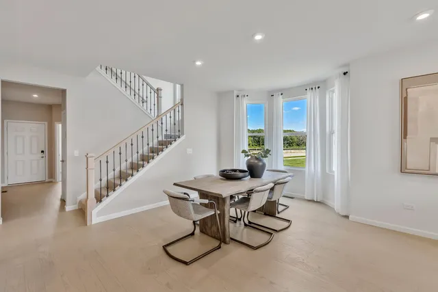 a view of a room with furniture and windows