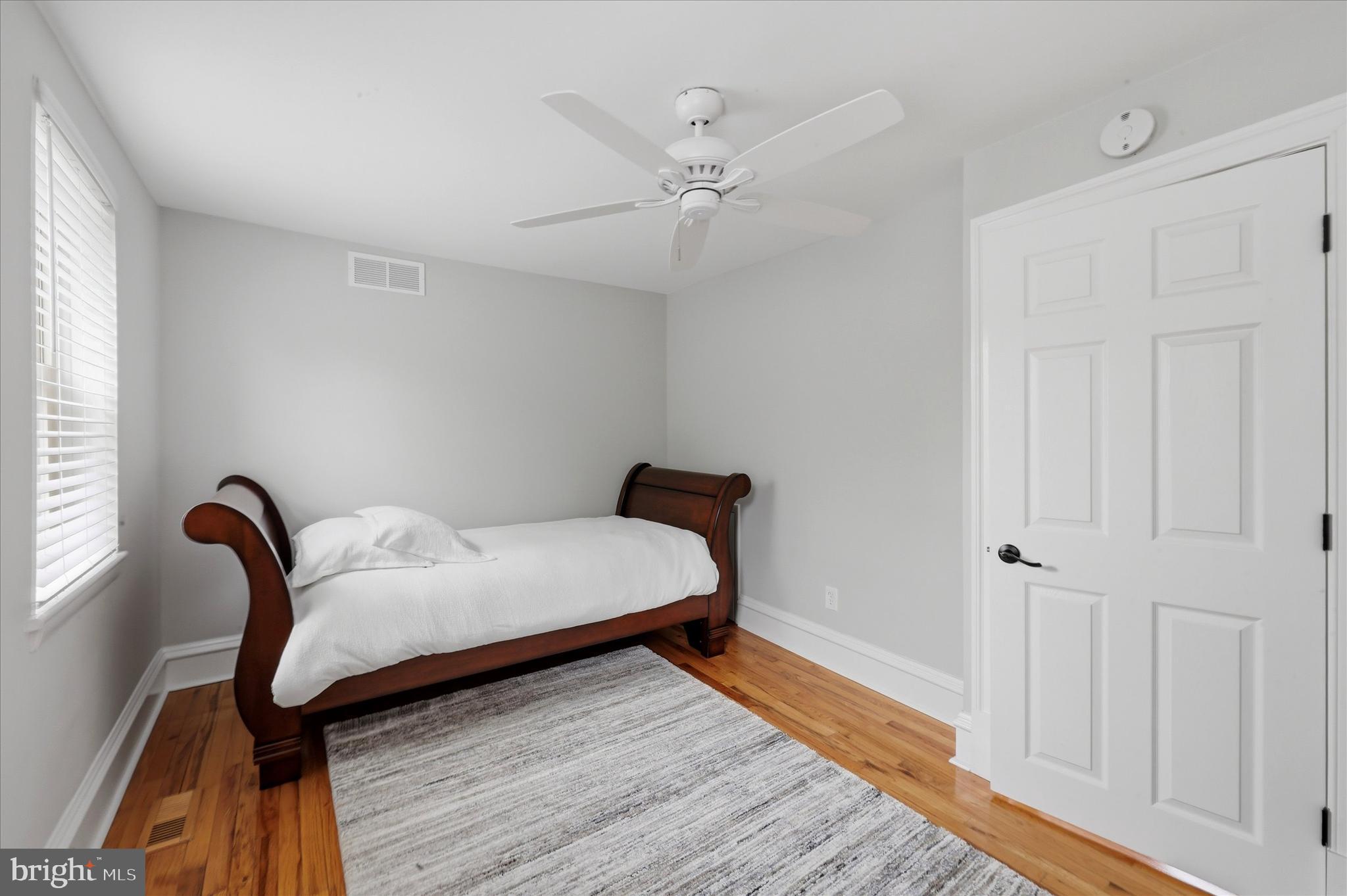 1917 Rodman Street Philadelphia, PA 19146 - Photo 13 of 31 a bedroom with a bed and a chandelier