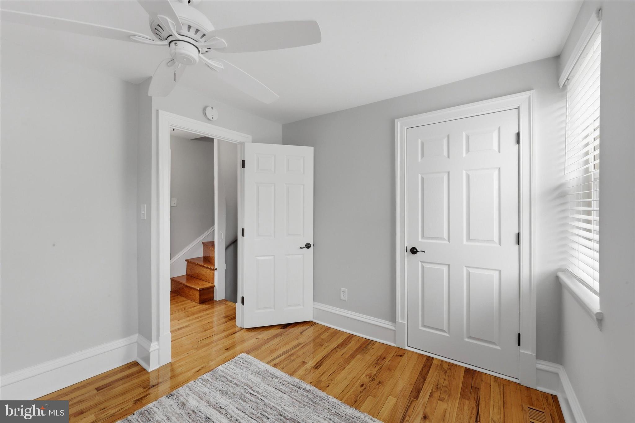 1917 Rodman Street Philadelphia, PA 19146 - Photo 15 of 31 wooden floor in an empty room with a window