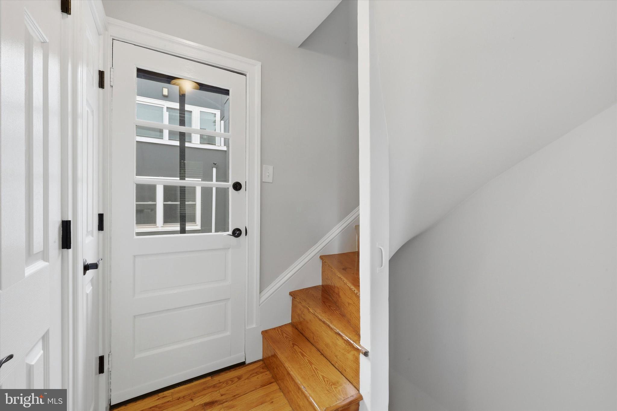 1917 Rodman Street Philadelphia, PA 19146 - Photo 23 of 31 a view of an entryway with wooden floor and staircase