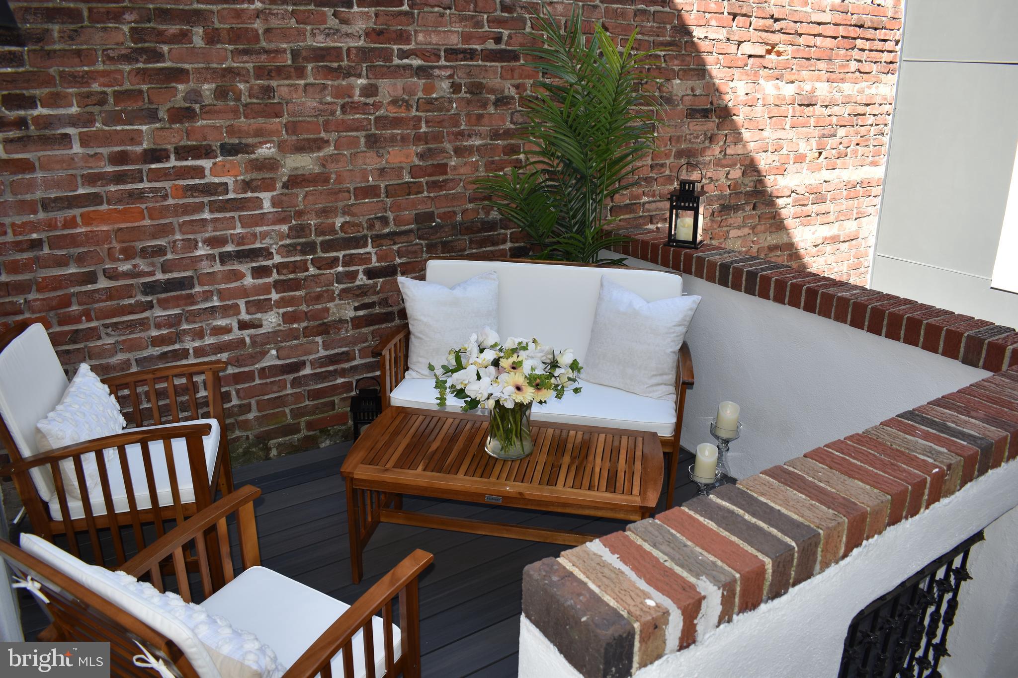1917 Rodman Street Philadelphia, PA 19146 - Photo 27 of 31 a view of a balcony with chairs and a potted plant