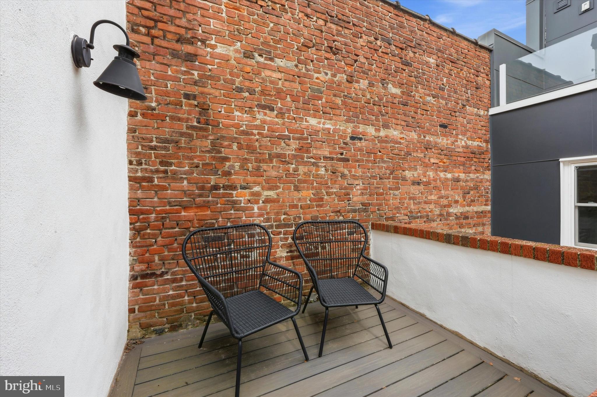 1917 Rodman Street Philadelphia, PA 19146 - Photo 29 of 31 a balcony with a table and chairs