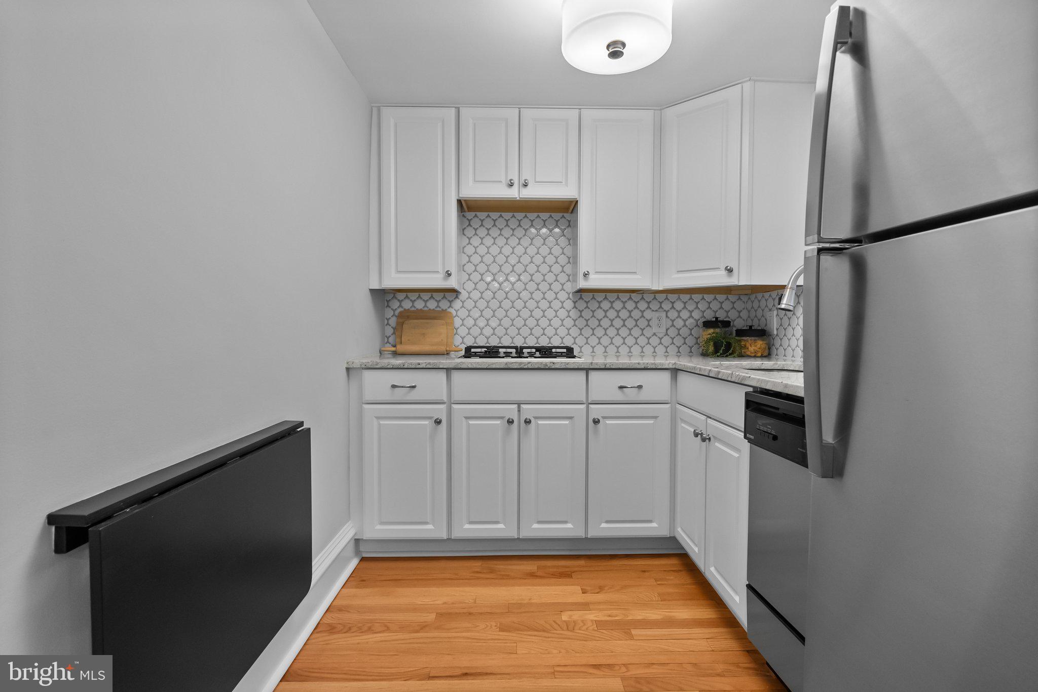 1917 Rodman Street Philadelphia, PA 19146 - Photo 5 of 31 a kitchen with a refrigerator and a stove