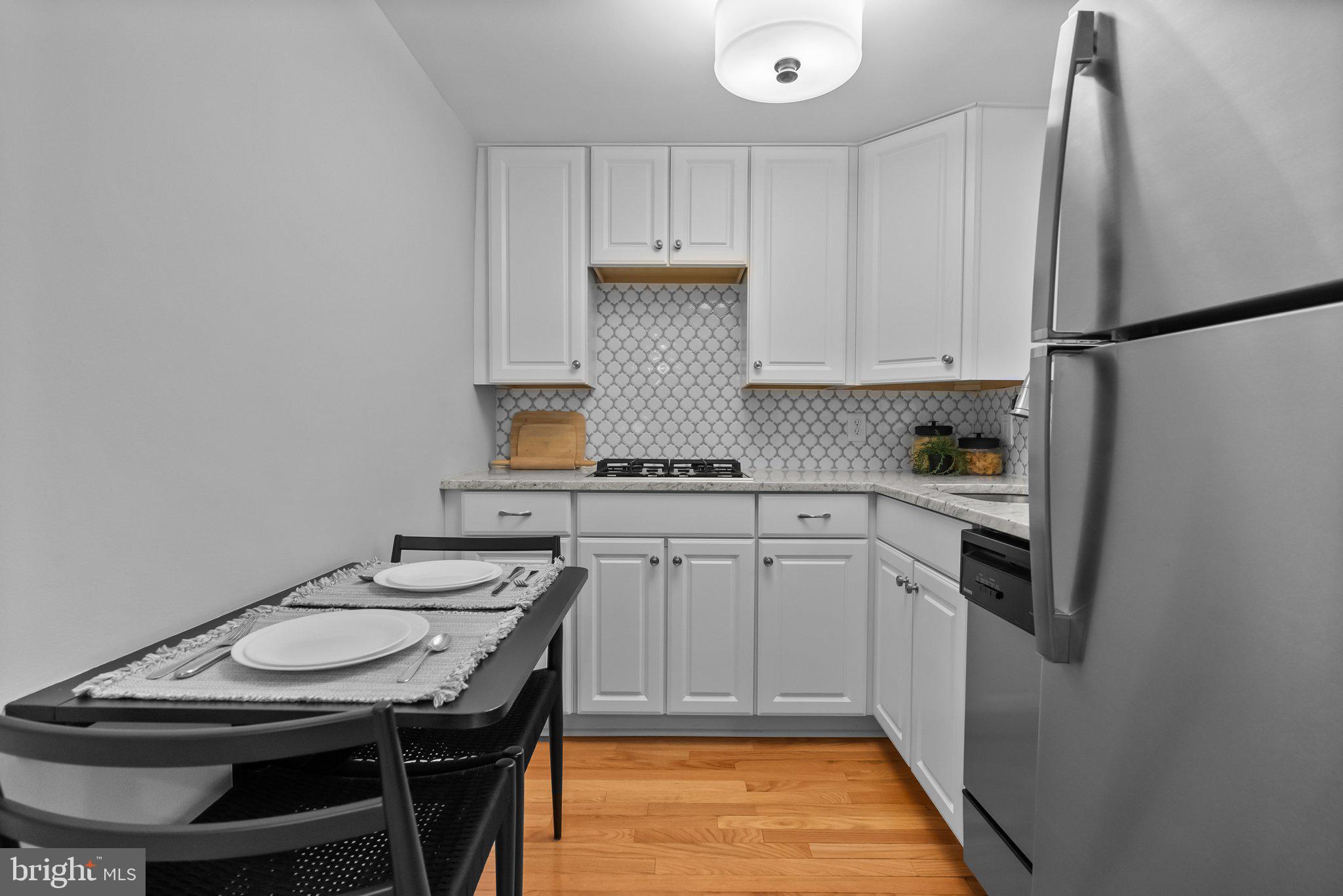 1917 Rodman Street Philadelphia, PA 19146 - Photo 7 of 31 a kitchen with stainless steel appliances granite countertop a sink stove and refrigerator