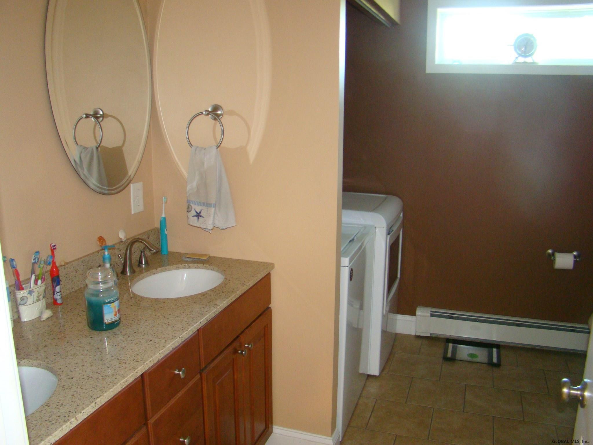 39 Altamont Road Voorheesville, NY 12186 - Photo 34 of 59 Full bath with washer and dryer.