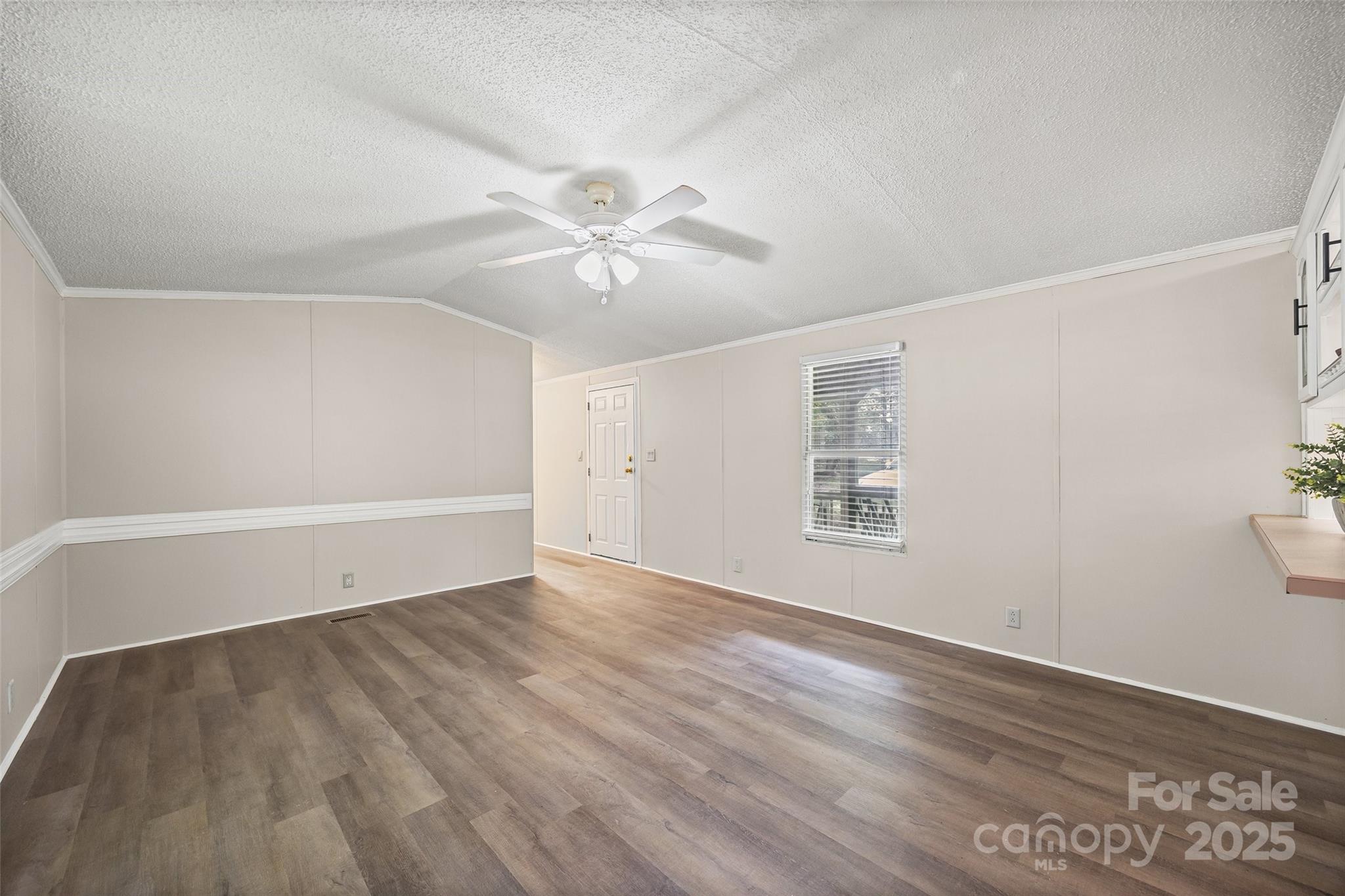 109 Daring Drive Cherryville, NC 28021 - Photo 13 of 30 wooden floor in an empty room with a window