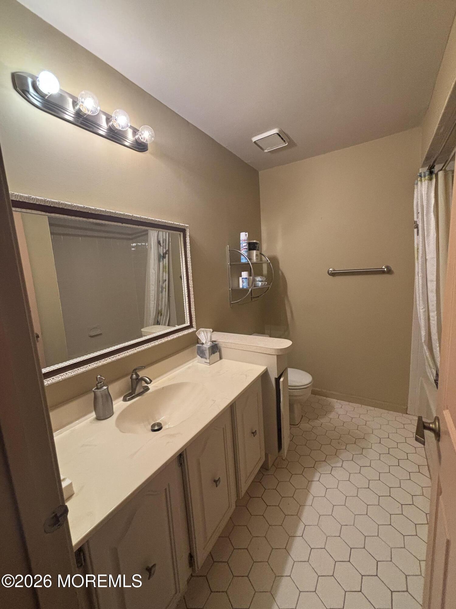 24 Olympus Way Brick, NJ 08724 - Photo 17 of 22 a bathroom with a sink double vanity and a mirror