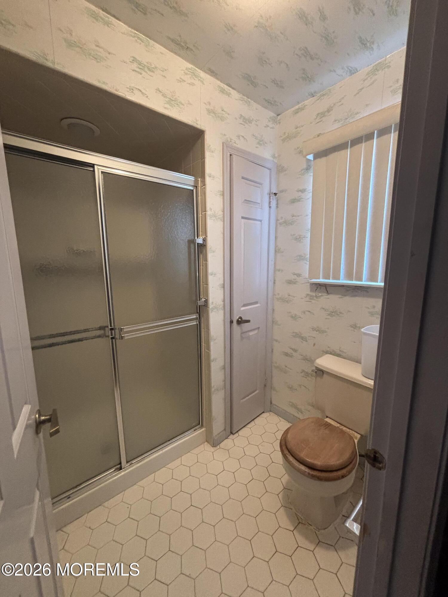 24 Olympus Way Brick, NJ 08724 - Photo 18 of 22 a bathroom with a toilet and a shower