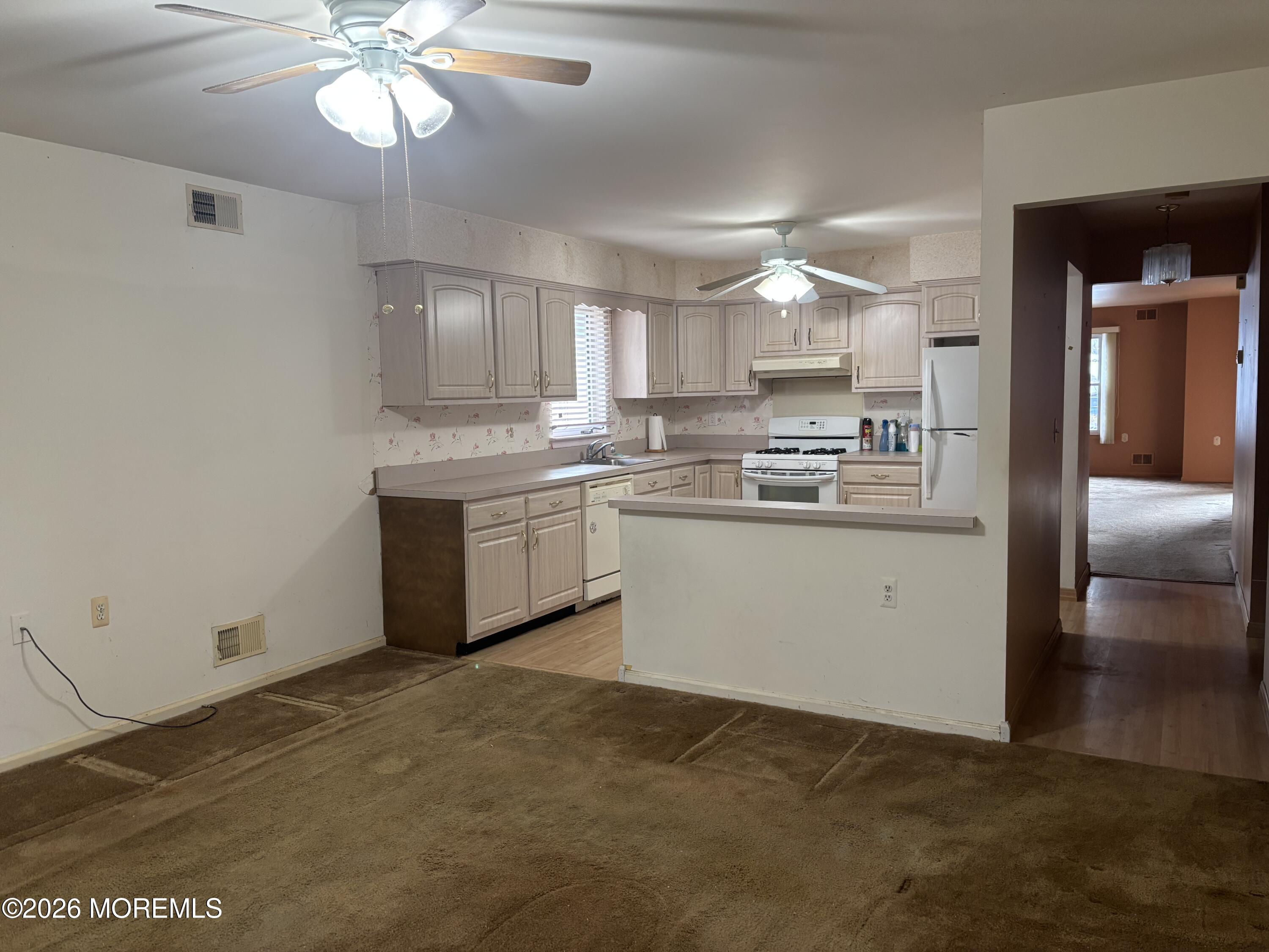 24 Olympus Way Brick, NJ 08724 - Photo 3 of 22 a kitchen with a stove a sink and cabinets