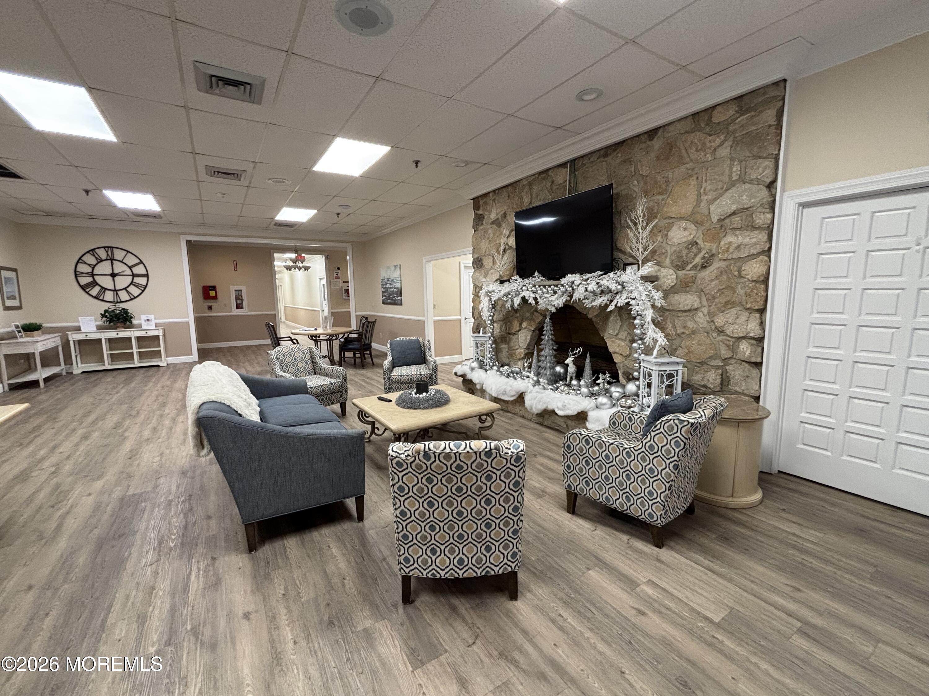 24 Olympus Way Brick, NJ 08724 - Photo 6 of 22 a living room with fireplace furniture and a flat screen tv