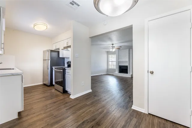 a view of a kitchen cabinets and wooden floor