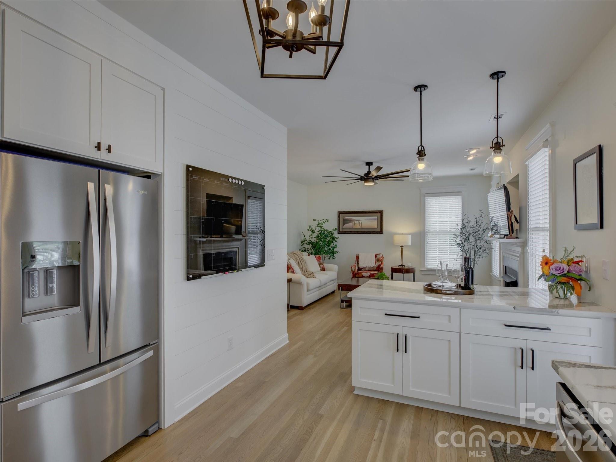 1305 Barnett Woods Crossing Fort Mill, SC 29708 - Photo 12 of 48 a kitchen with stainless steel appliances a sink cabinets and a refrigerator