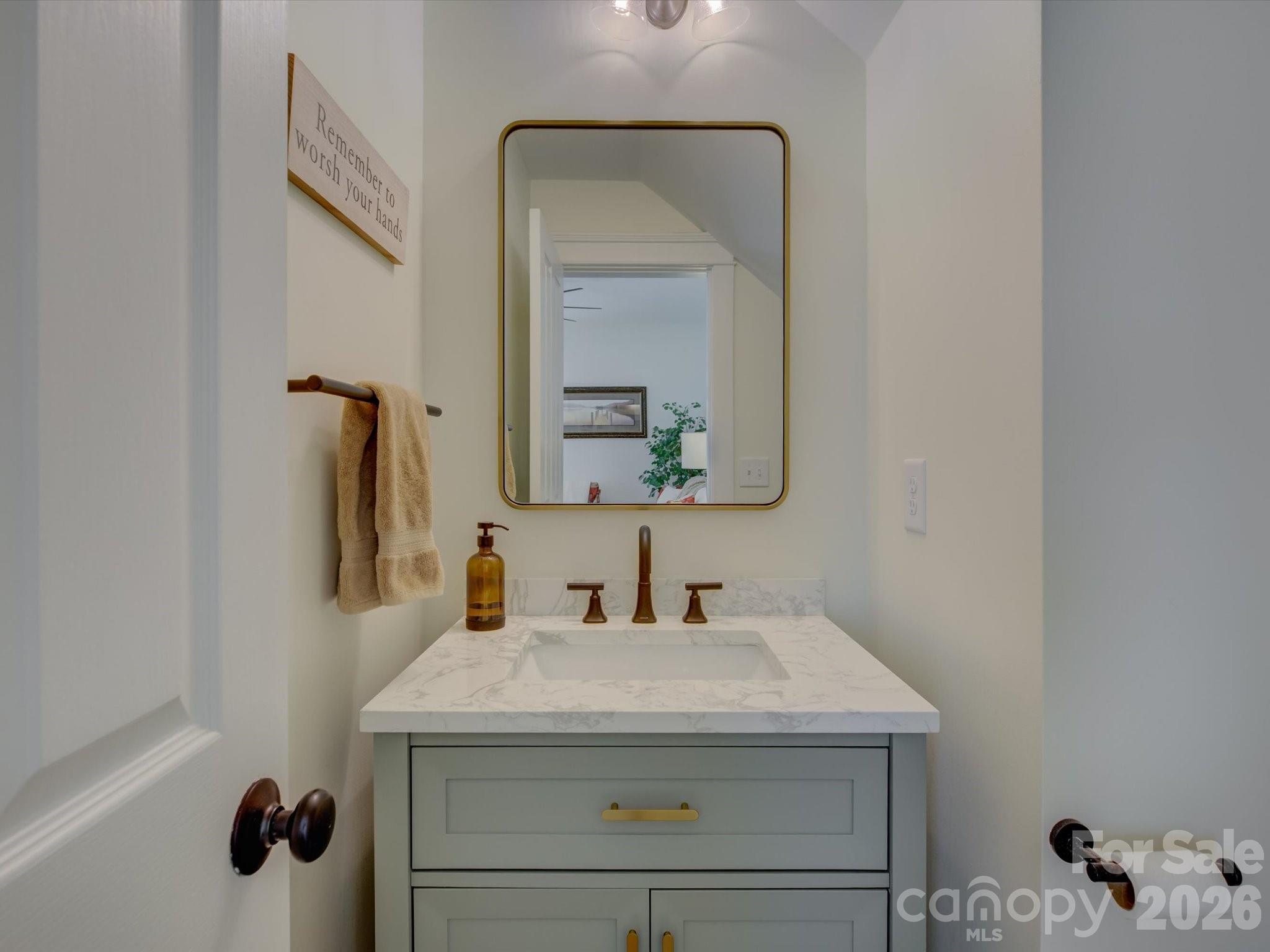 1305 Barnett Woods Crossing Fort Mill, SC 29708 - Photo 17 of 48 a bathroom with a sink and a mirror