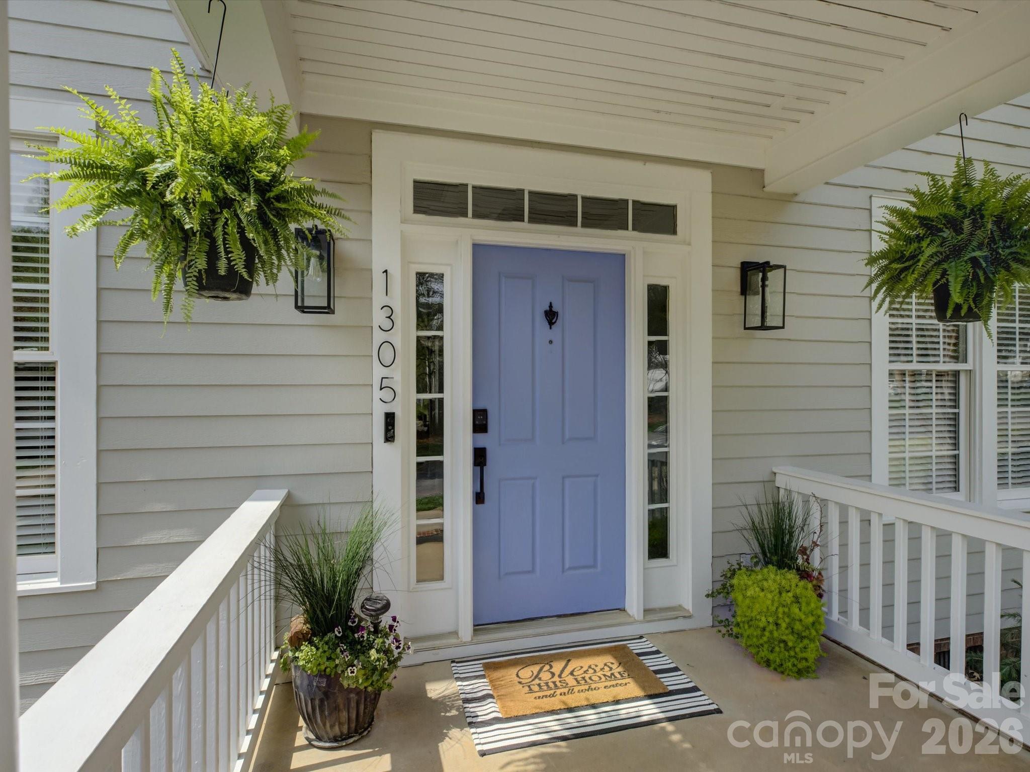 1305 Barnett Woods Crossing Fort Mill, SC 29708 - Photo 2 of 48 a potted plant sitting in front of a house