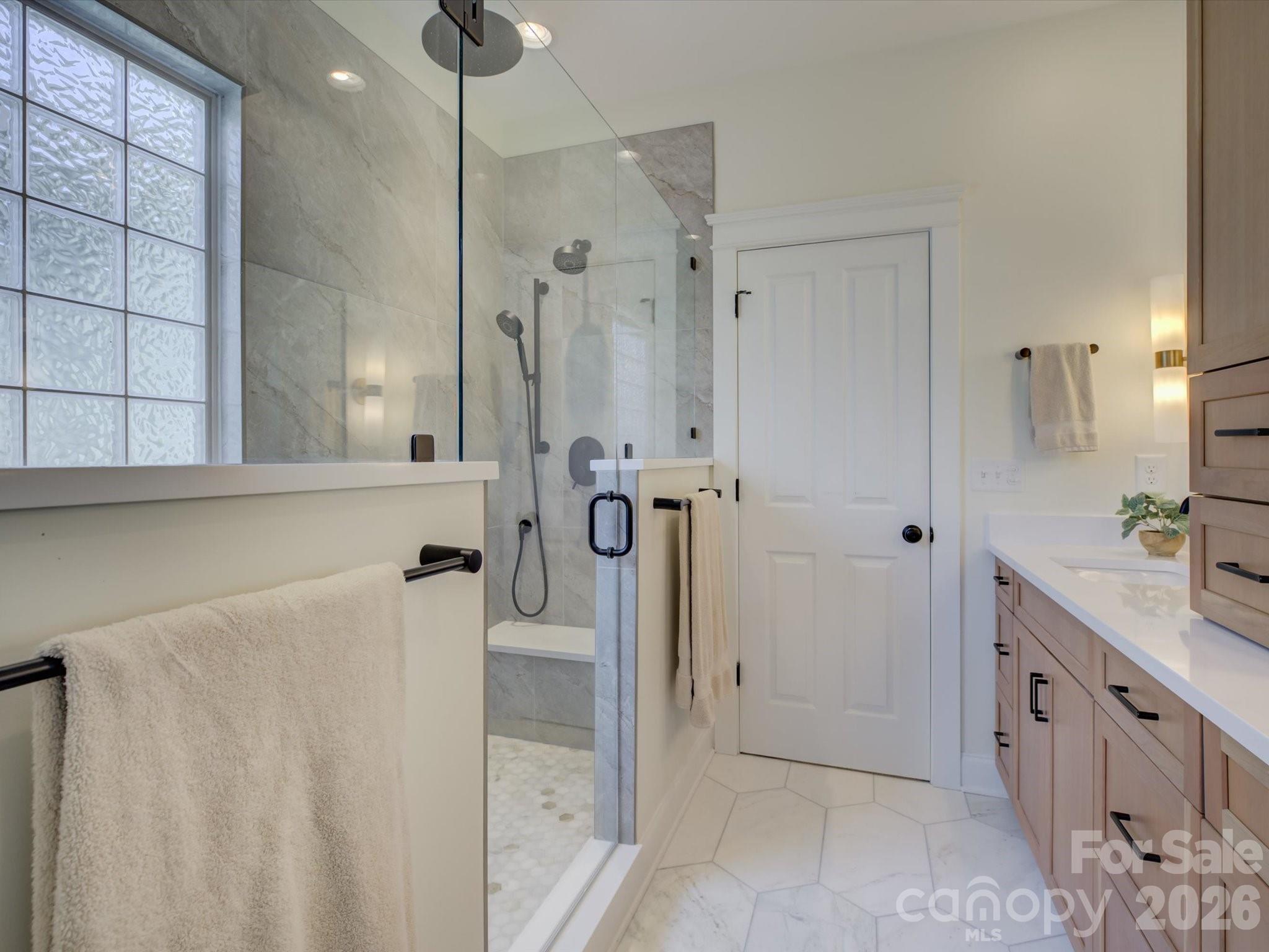 1305 Barnett Woods Crossing Fort Mill, SC 29708 - Photo 25 of 48 a bathroom with a double vanity sink a mirror and a shower