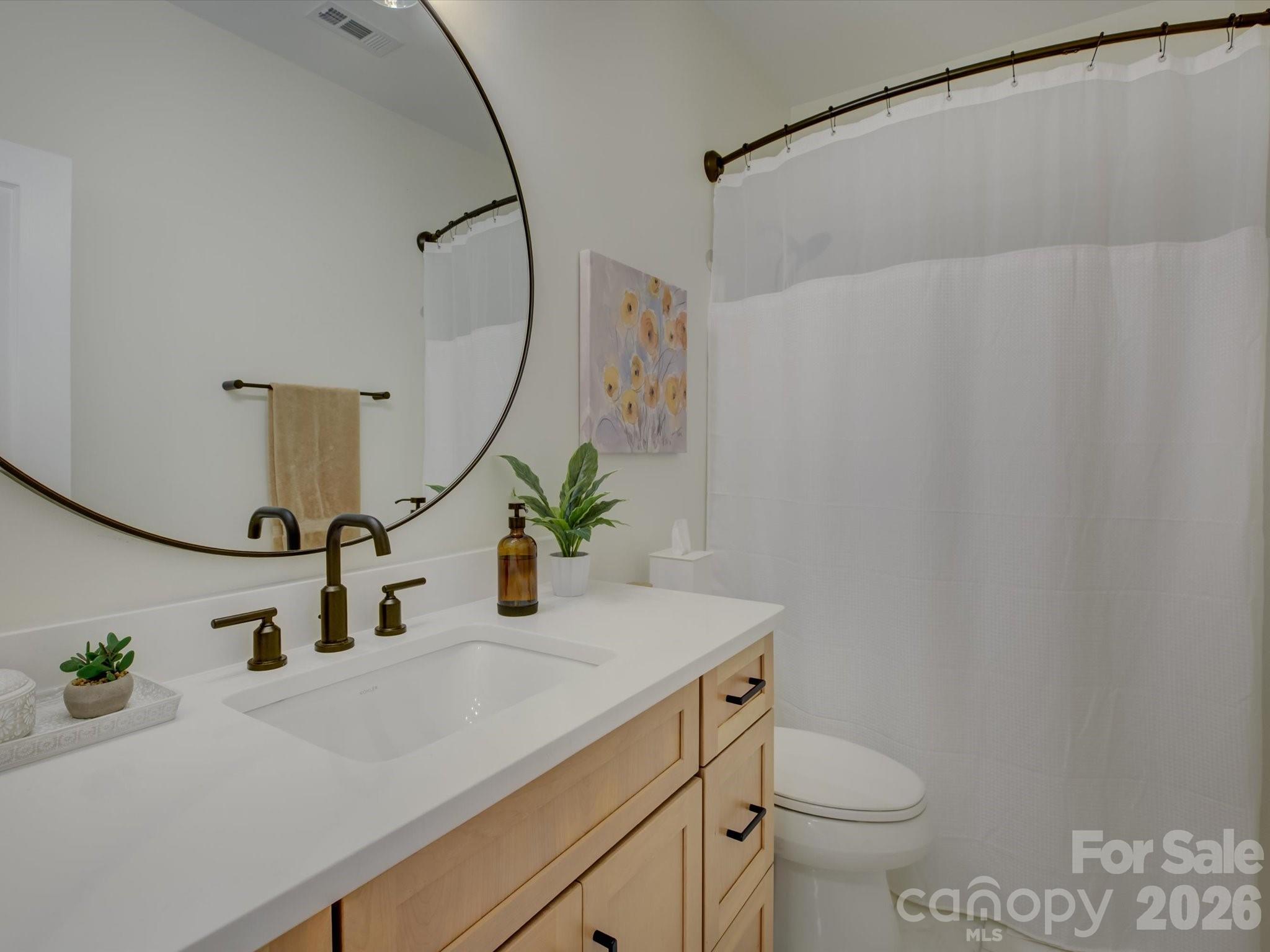 1305 Barnett Woods Crossing Fort Mill, SC 29708 - Photo 30 of 48 a bathroom with a sink and a toilet