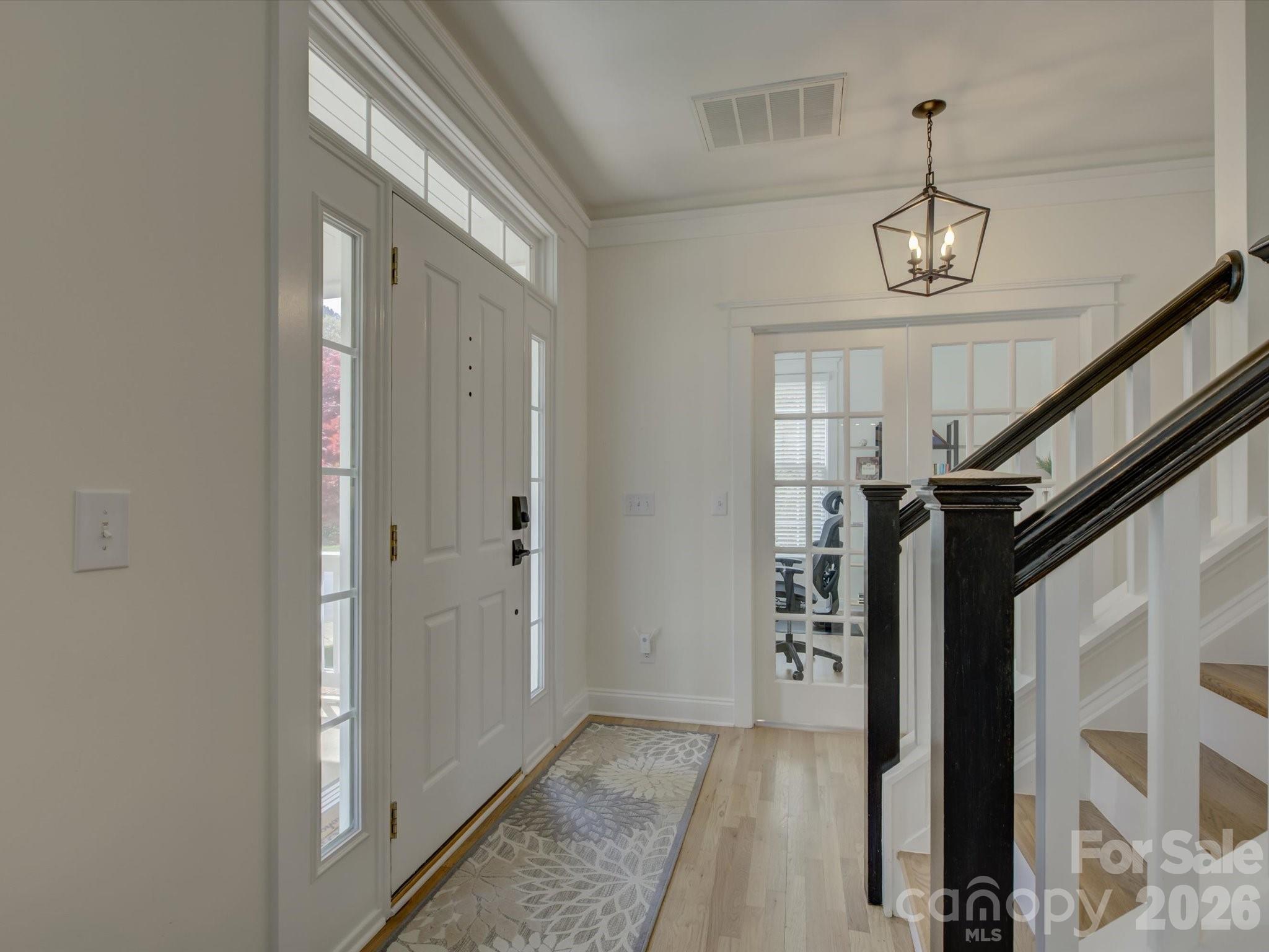 1305 Barnett Woods Crossing Fort Mill, SC 29708 - Photo 3 of 48 a view of hallway with stairs and wooden floor