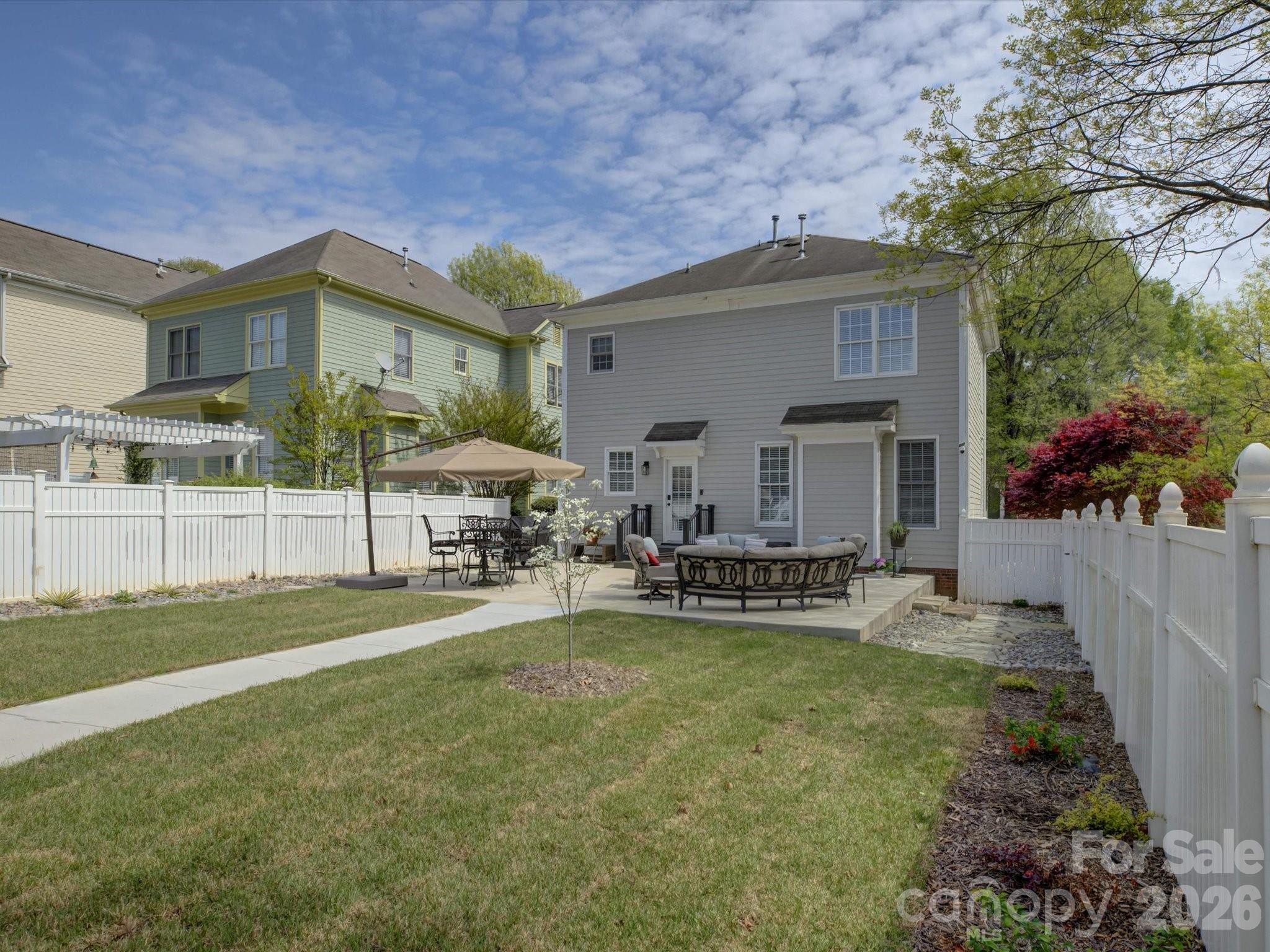 1305 Barnett Woods Crossing Fort Mill, SC 29708 - Photo 36 of 48 a view of a house with a yard and sitting area