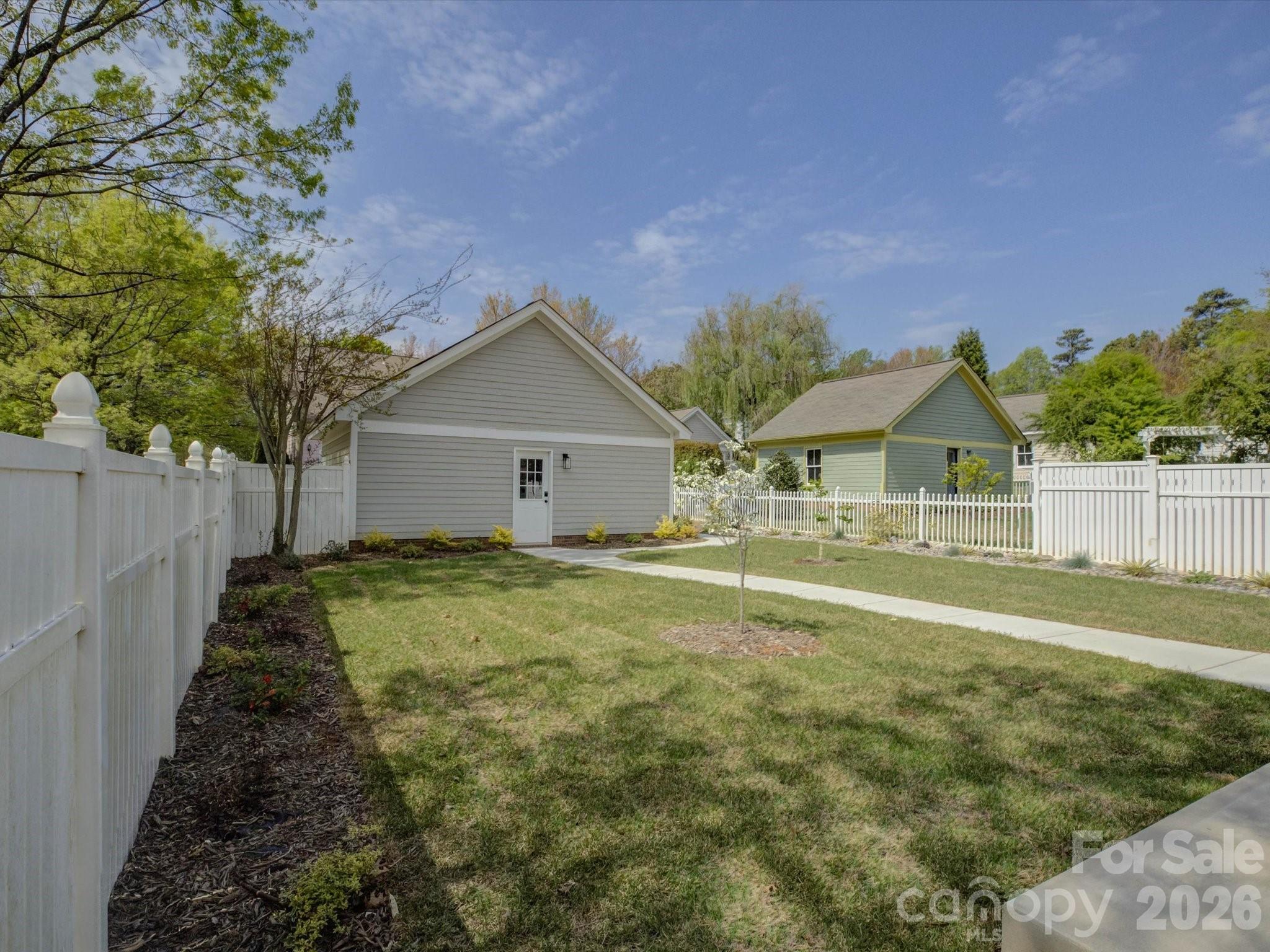 1305 Barnett Woods Crossing Fort Mill, SC 29708 - Photo 43 of 48 a house view with a garden space
