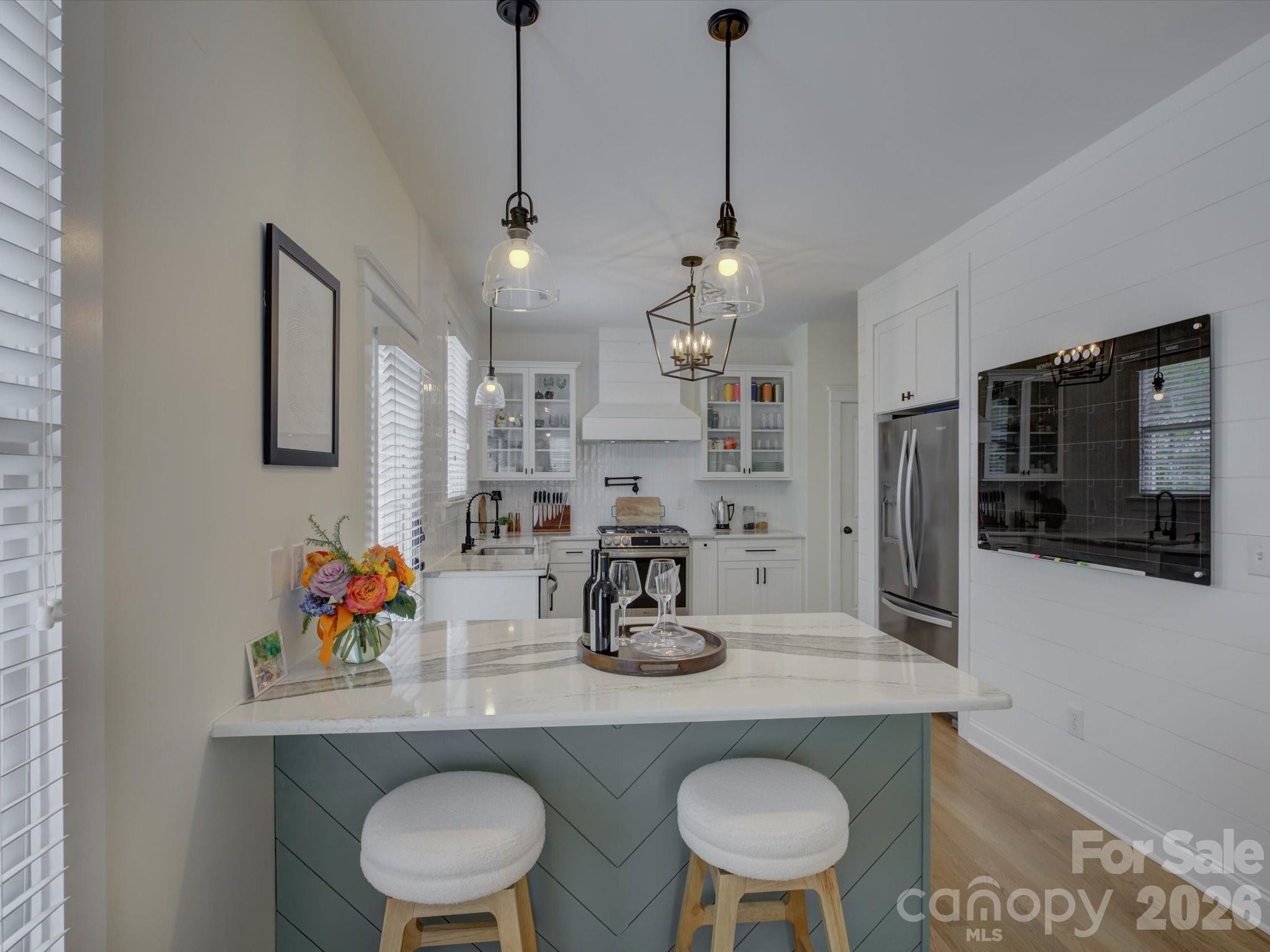 1305 Barnett Woods Crossing Fort Mill, SC 29708 - Photo 10 of 48 a kitchen with a table and chairs in it