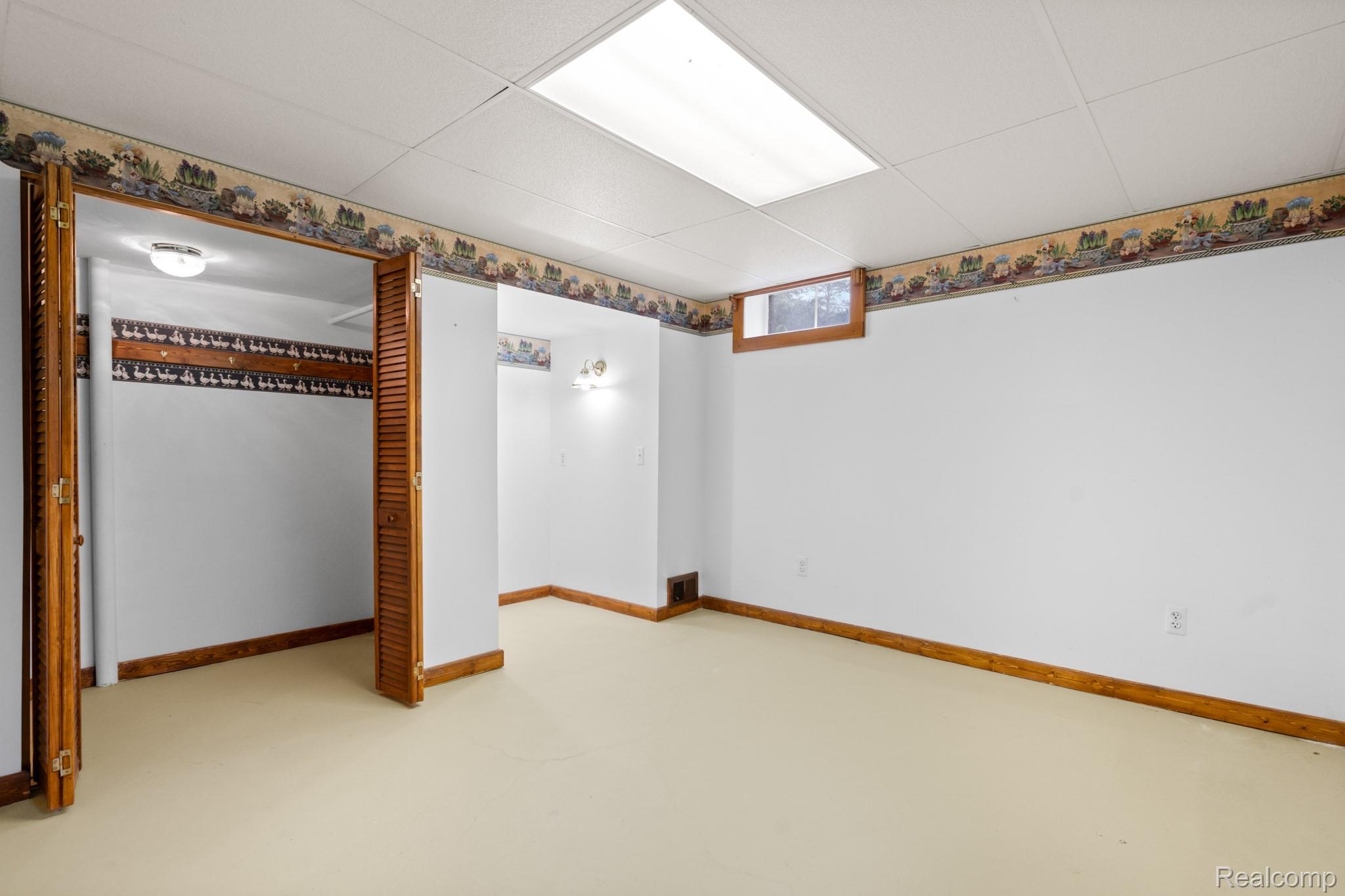 7540 Dexter-Pinckney Road Dexter, MI 48130 - Photo 47 of 50 Basement bedroom