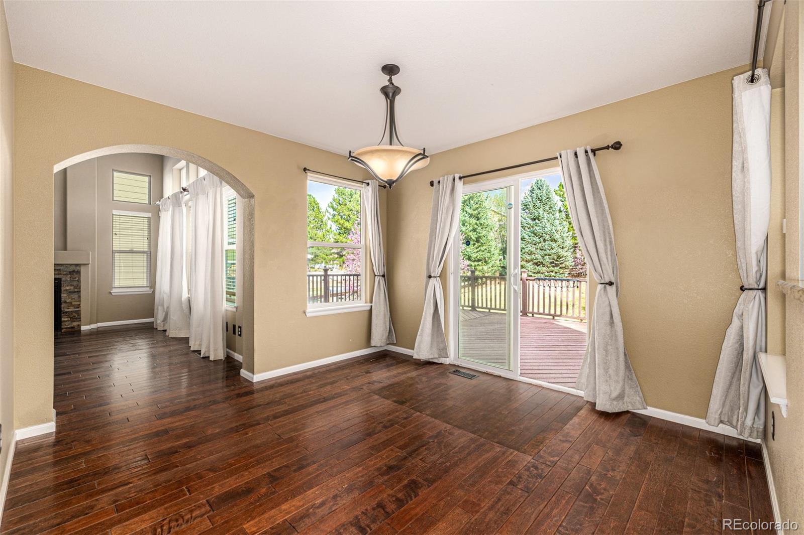 10244 Royal Eagle Street Highlands Ranch, CO 80129 - Photo 15 of 46 a view of entryway with wooden floor and door