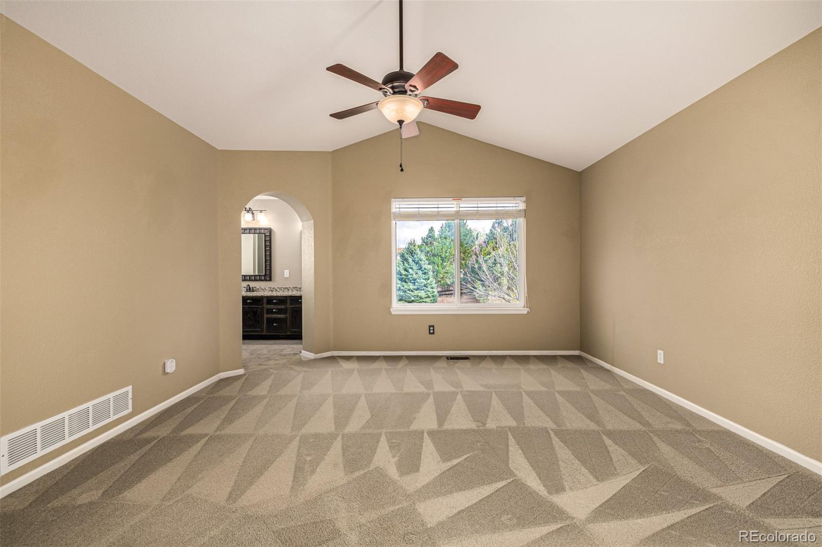 10244 Royal Eagle Street Highlands Ranch, CO 80129 - Photo 21 of 46 a view of an empty room with a window