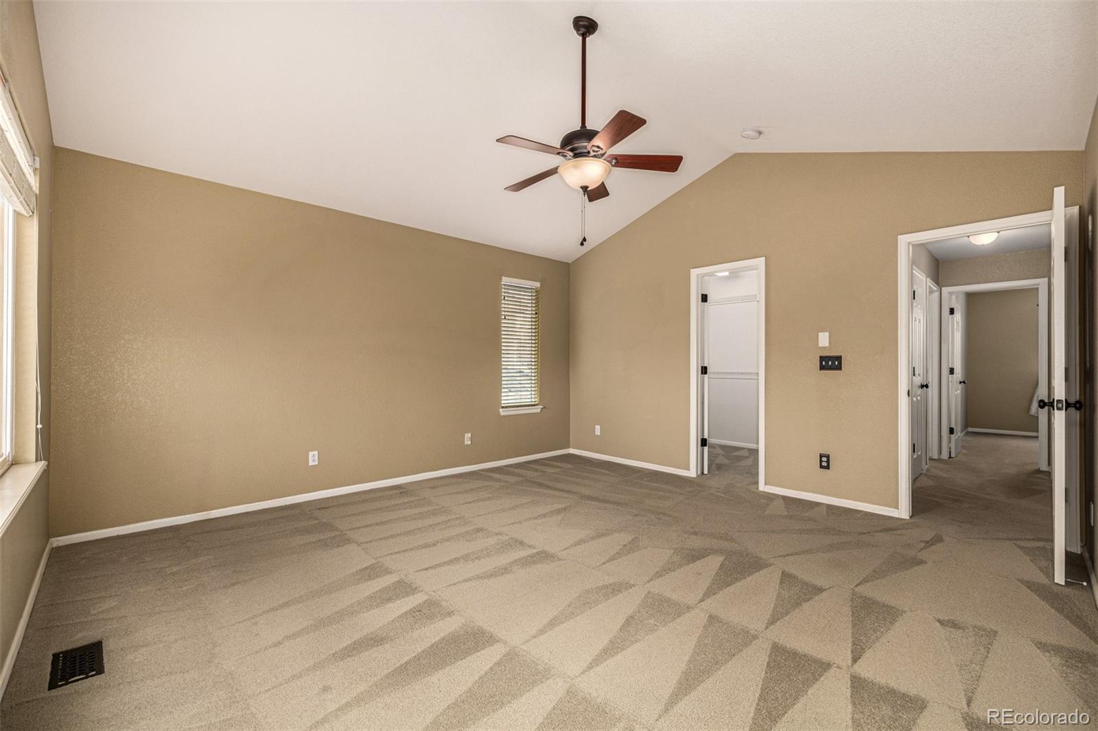 10244 Royal Eagle Street Highlands Ranch, CO 80129 - Photo 23 of 46 an empty room with fan and windows