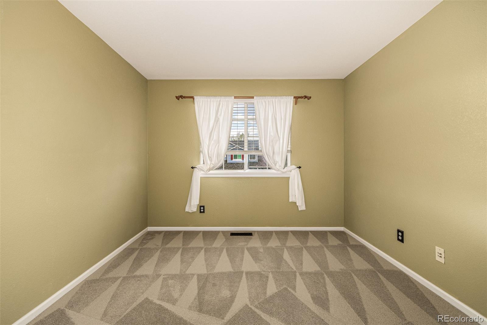 10244 Royal Eagle Street Highlands Ranch, CO 80129 - Photo 27 of 46 a view of a room with a window