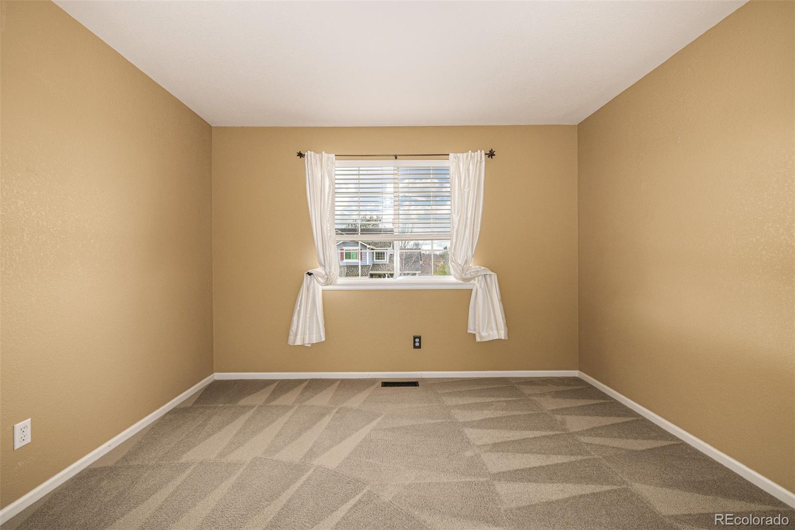 10244 Royal Eagle Street Highlands Ranch, CO 80129 - Photo 29 of 46 an empty room with a window