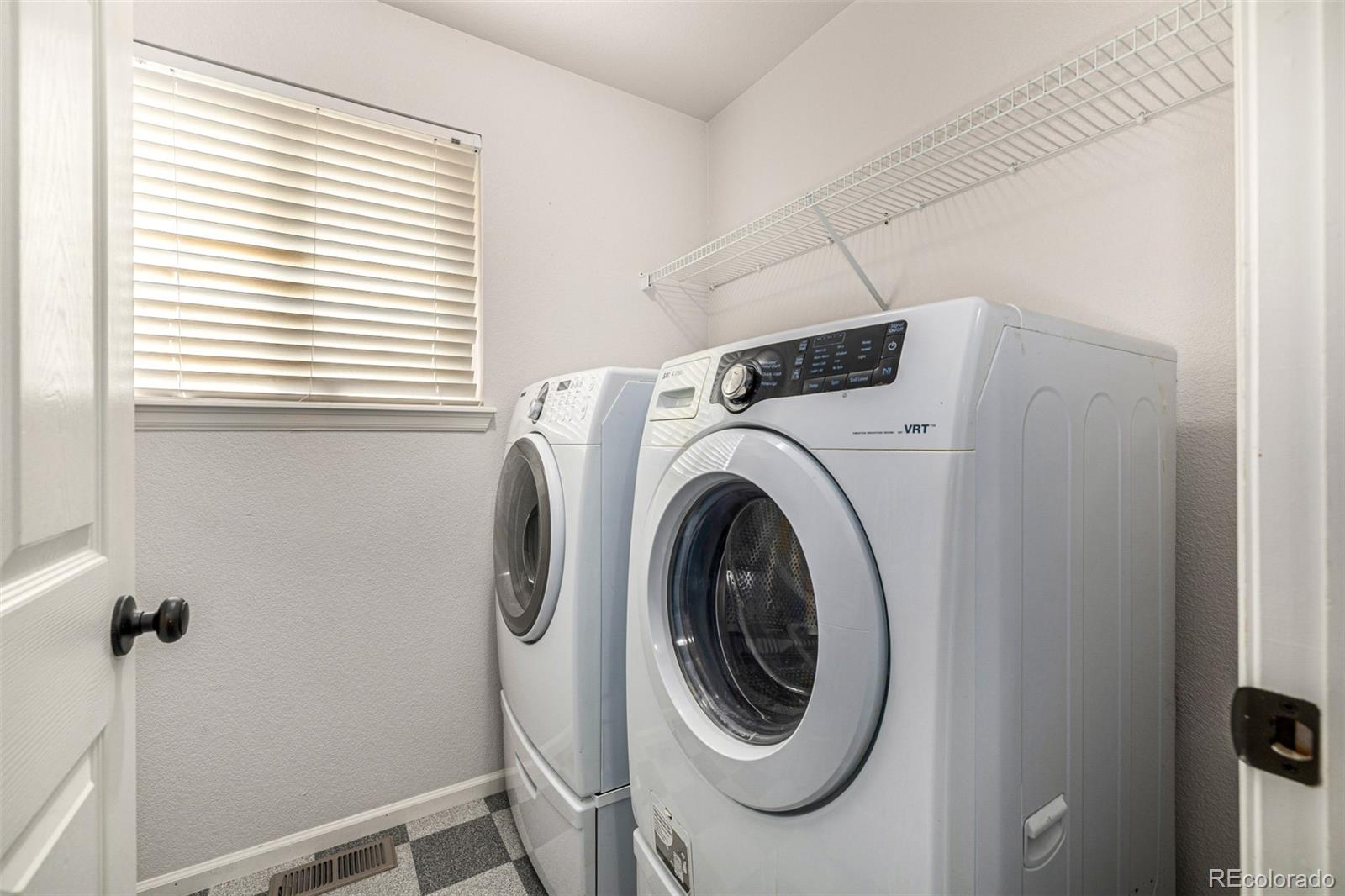 10244 Royal Eagle Street Highlands Ranch, CO 80129 - Photo 36 of 46 a utility room with dryer and washer