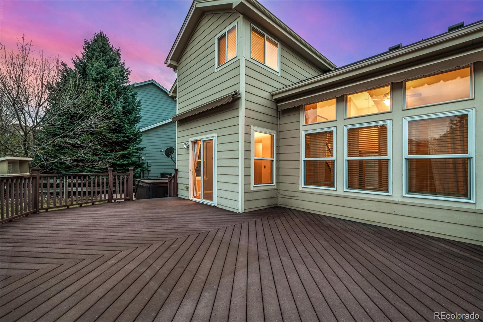 10244 Royal Eagle Street Highlands Ranch, CO 80129 - Photo 38 of 46 a view of a house with a wooden deck